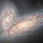 'Cosmic butterfly' wings shimmer in image of violently colliding galaxies